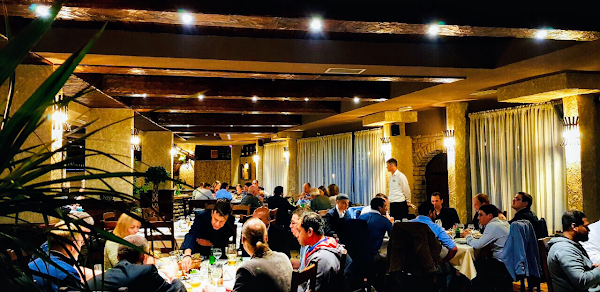 This is a picture of people eating in the Olimpija restaurant in Montenegro.